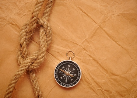 compass and rope on old yellow paper  の写真素材