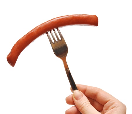 close up of sausage and fork on white background の写真素材