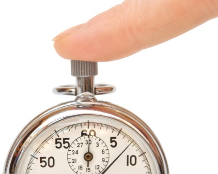 closeup stopwatch in hand isolated on white backgroundの写真素材