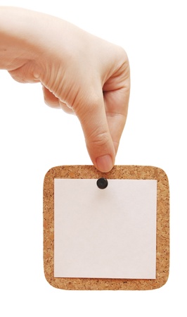 empty cork in the hand isolated white backgroundの写真素材