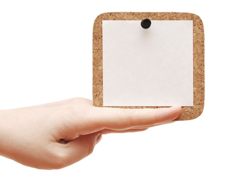 empty cork in the hand isolated white backgroundの写真素材