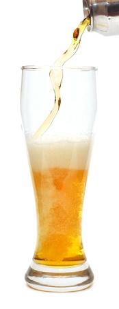 Pouring beer into glass with white background