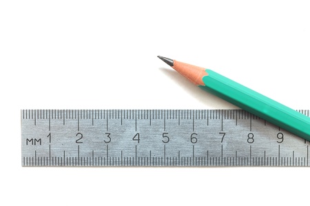 steel ruler and wood pencil on whiteの写真素材