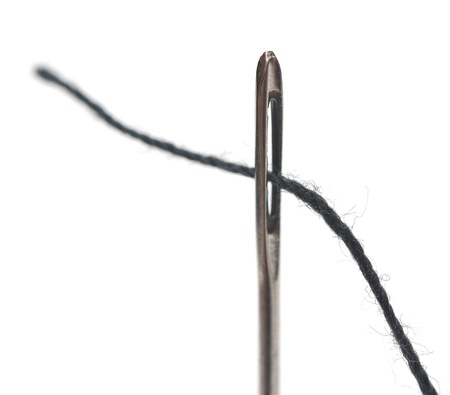 Needle and thread on white background の写真素材