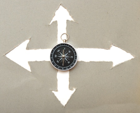 compass and arrow cut in cardboardの写真素材