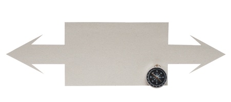 Cardboard navigation arrows with compass on a white background の写真素材