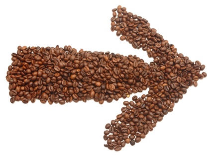 an arrow made of coffee beans pointing the wayの写真素材