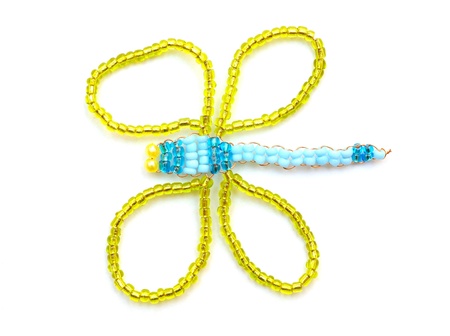isolated dragonfly jewelry on white background の写真素材
