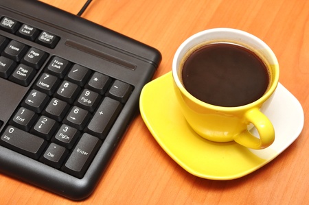 empty keyboard and coffee cupの写真素材