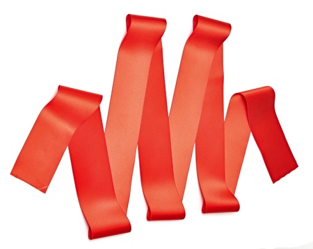 Red ribbon nicely uncurledon pure white. Preparation for gift wrapping.の写真素材