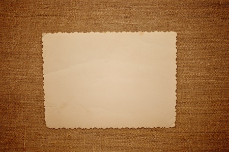 Old vintage photo with a rope on brown canvas backgroundの写真素材