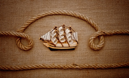 rope and model classic boat on canvas of burlapの写真素材
