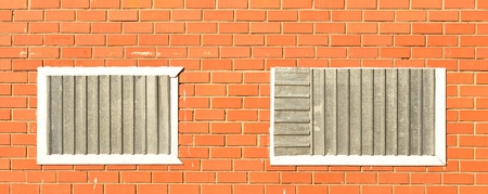 closed windows on the brick wallの写真素材