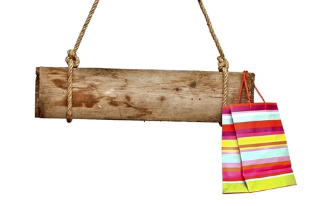 wooden signboard with shopping bag isolated on whiteの写真素材