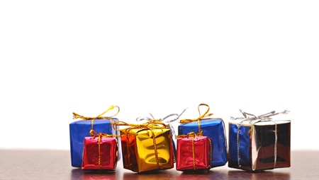 Closeup of colorful gifts box on wood background