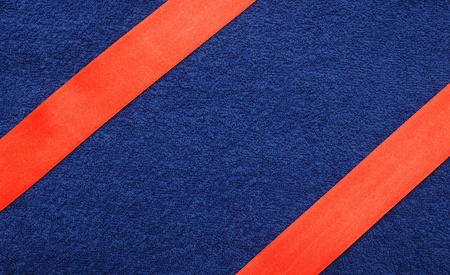 A wrapping red ribbon gift on blue backgroundの写真素材