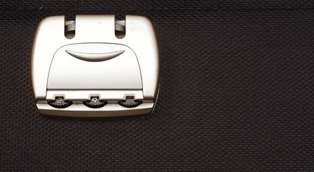 closeup photo of a combination lock on a black color suitcase の写真素材