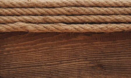 old texture of wooden boards with ship rope. の写真素材