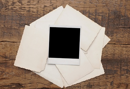 old photos on a wooden background の写真素材