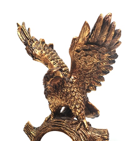 golden eagle statue on a white background.の写真素材