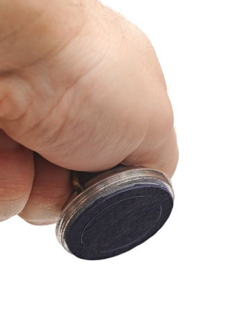 Hand with rubber stamp - isolated on whiteの写真素材