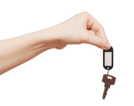 silver key with blank tag in hand isolated on white  space for your text