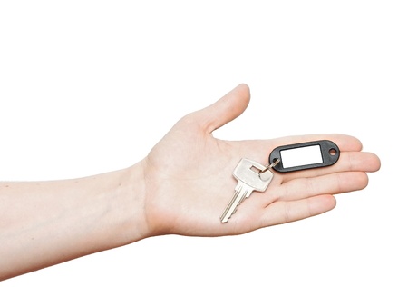 silver key with blank tag in hand isolated on white  space for your text