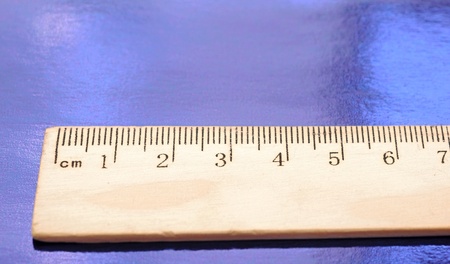 A wood ruler on blue background