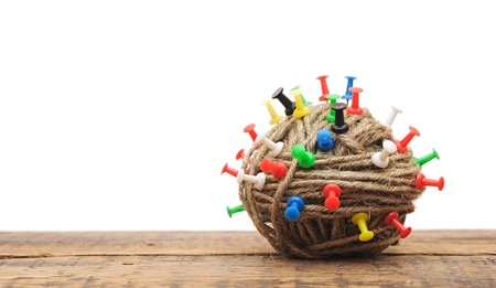 Clew on white background with color push pinの写真素材