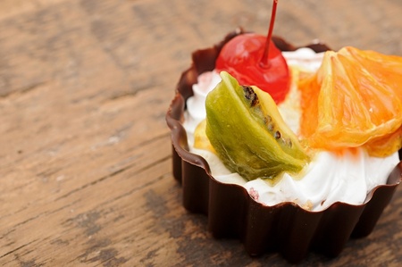 fresh baked cupcake on a dark wooden backgroundの写真素材