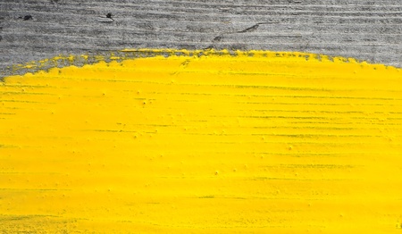 yellow paint on old wooden backgroundの写真素材