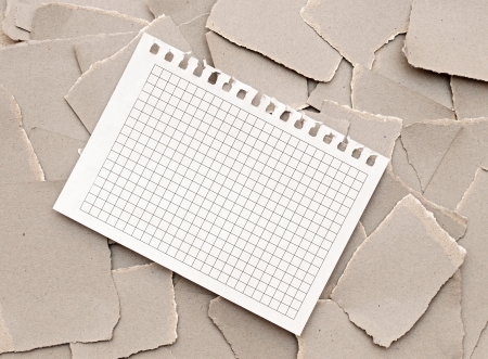 blank paper on gray cardboard ripped backgroundの写真素材