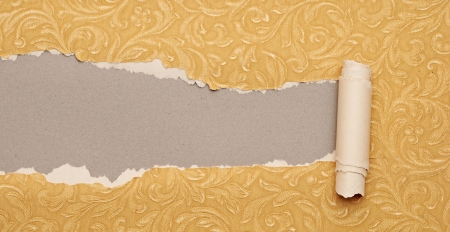 Torn gold paper background with texture and copy space for your text 