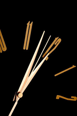 black wall clock, two minutes to twelve の写真素材