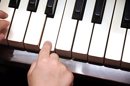 Piano playing hands of a child の写真素材
