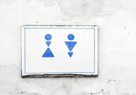 Ancient toilet sign on cement wallの写真素材