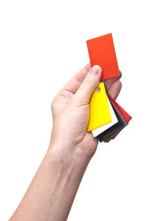 female hands holding paint color swatchesの写真素材