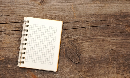 Open blank note book on grunge wood . With copy spaceの写真素材