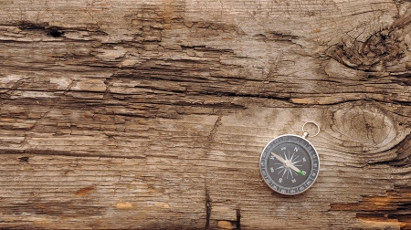 Compass on the old wooden background の写真素材