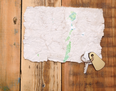Old paper and key with space for textの写真素材