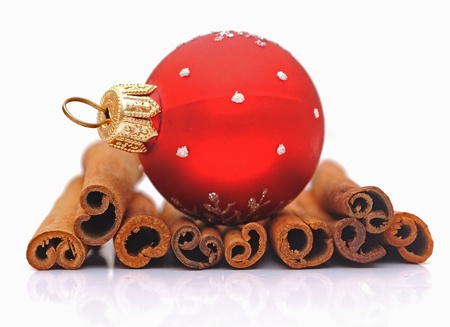 cinnamon sticks and christmas ball の写真素材