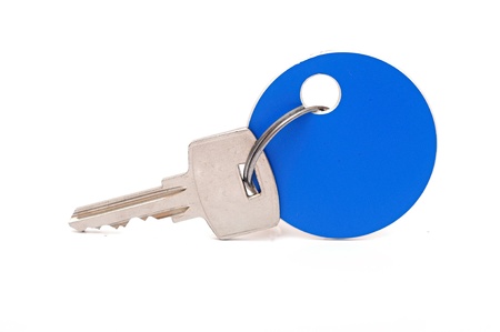 Key with blank blue tag isolated on the white background 