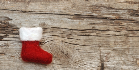 Christmas stocking on wooden background の写真素材