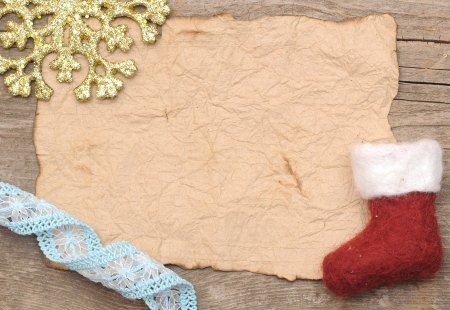 Christmas decoration and vintage paper on the wood background の写真素材