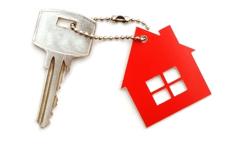 house keys and keychain on white background 