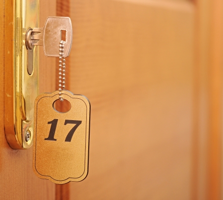 key in keyhole with numbered label の写真素材