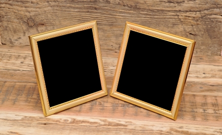 two blank photo frame on old table の写真素材