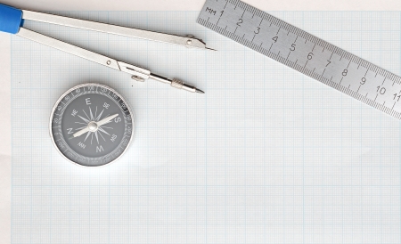 Still life photo of engineering graph paper with pencil, compass and metal ruler blank to add your own designの写真素材