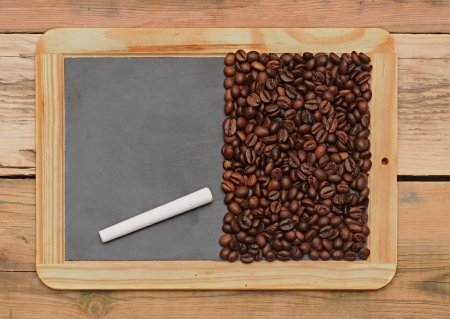 Coffee beans on a blackboard の写真素材