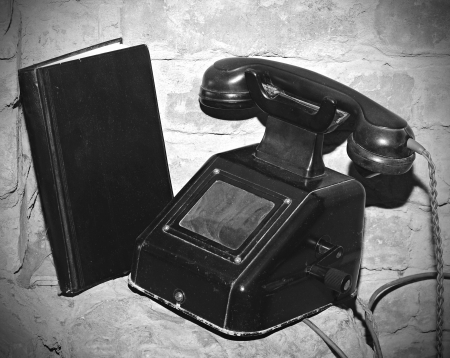 Vintage telephone on old stone table の写真素材